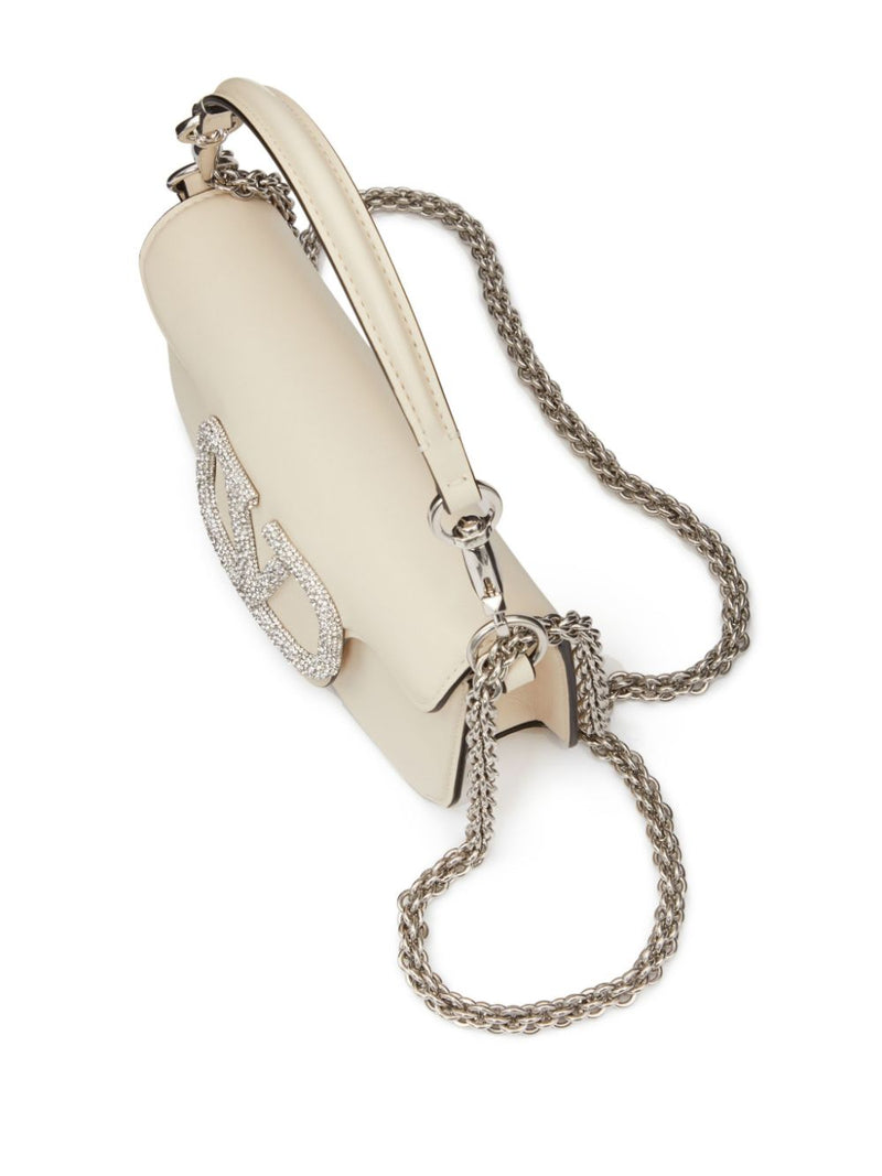 Valentino Garavani small Locò crystal-embellished shoulder bag - Leather... | Urbalenti™ NYC