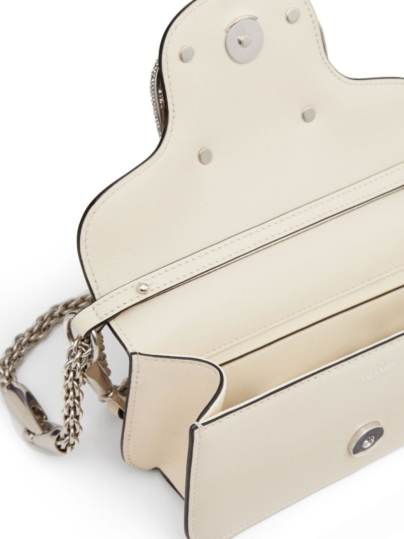 Valentino Garavani small Locò crystal-embellished shoulder bag - Leather... | Urbalenti™ NYC