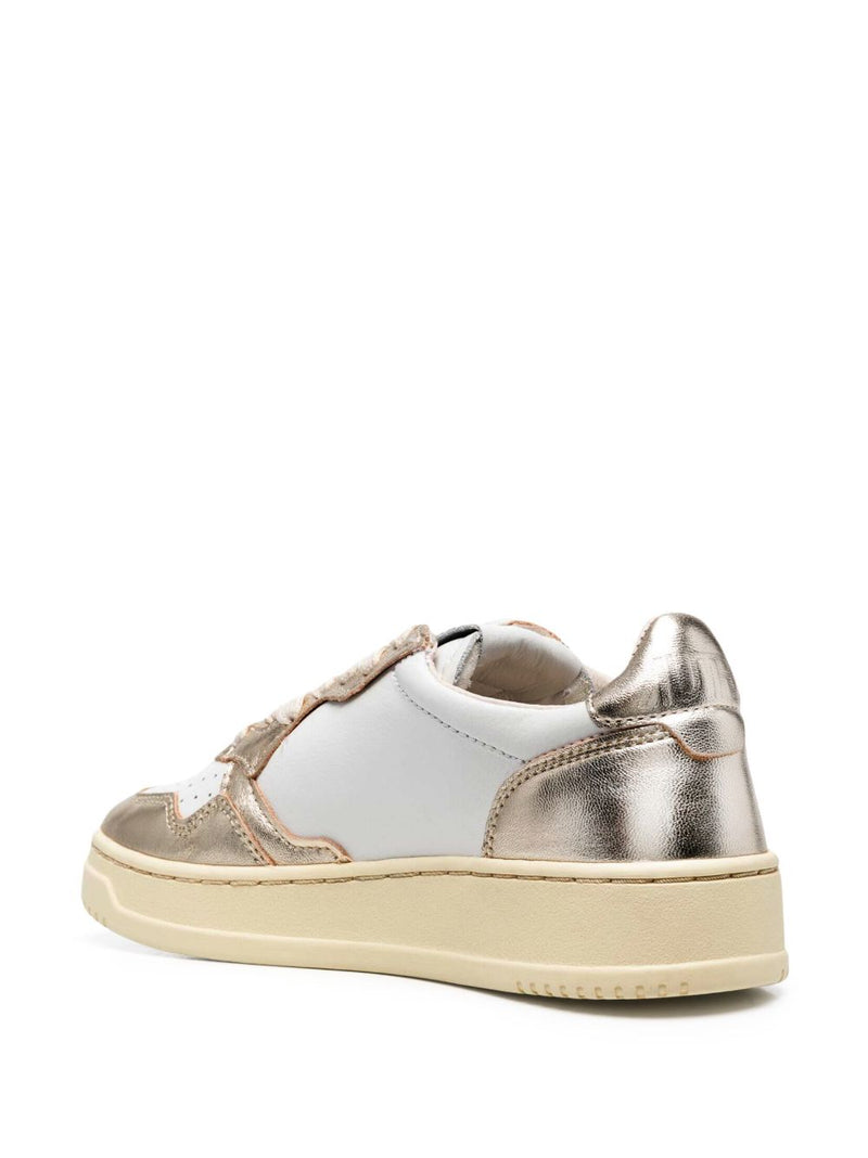Autry MEDALIST LOW BICOLOR SNEAKERS IN WHITE AND PLATINUM METALLIC LEATHER | Urbalenti™ NYC