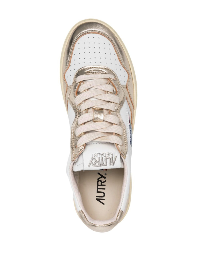 Autry MEDALIST LOW BICOLOR SNEAKERS IN WHITE AND PLATINUM METALLIC LEATHER | Urbalenti™ NYC
