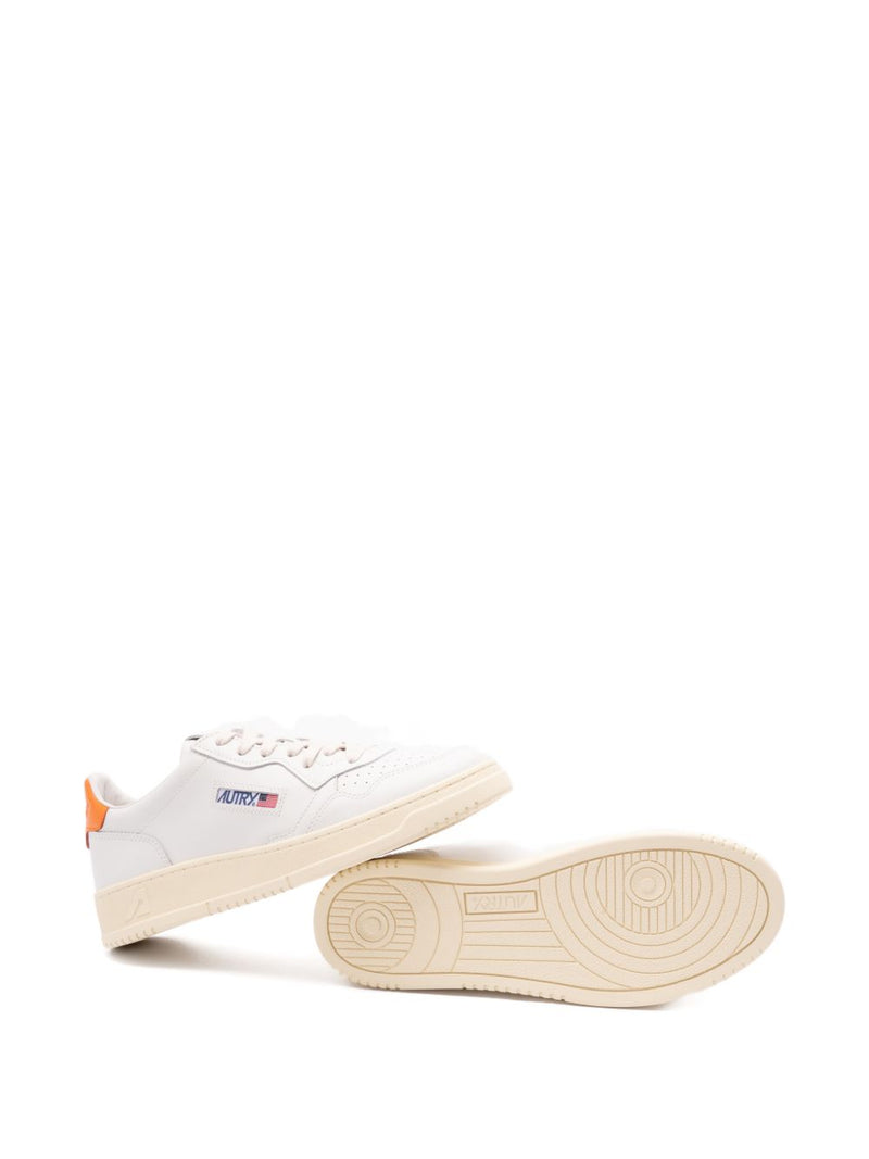 Autry MEDALIST LOW SNEAKERS IN WHITE LEATHER AND PARSIMMON ORANGE | Urbalenti™ NYC