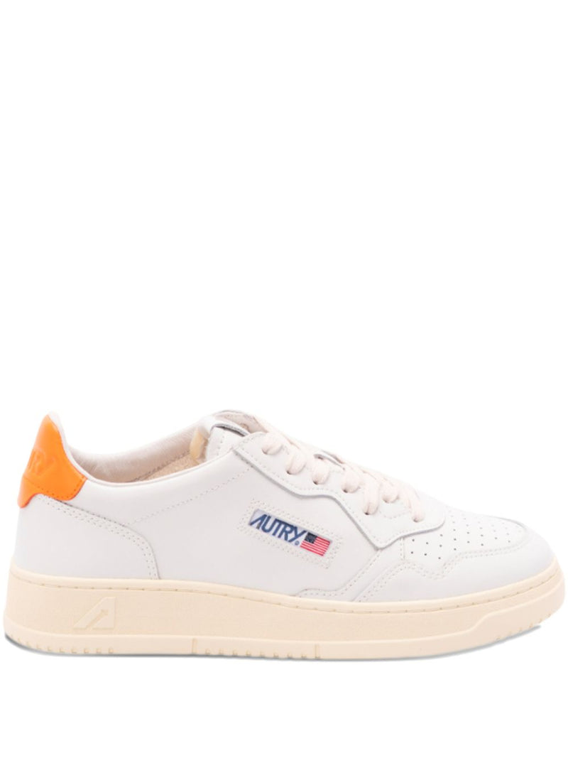 Autry MEDALIST LOW SNEAKERS IN WHITE LEATHER AND PARSIMMON ORANGE | Urbalenti™ NYC