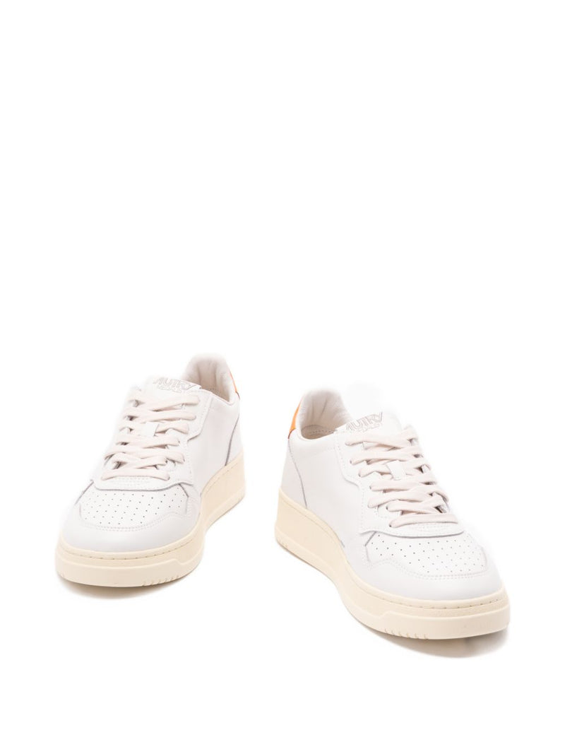 Autry MEDALIST LOW SNEAKERS IN WHITE LEATHER AND PARSIMMON ORANGE | Urbalenti™ NYC