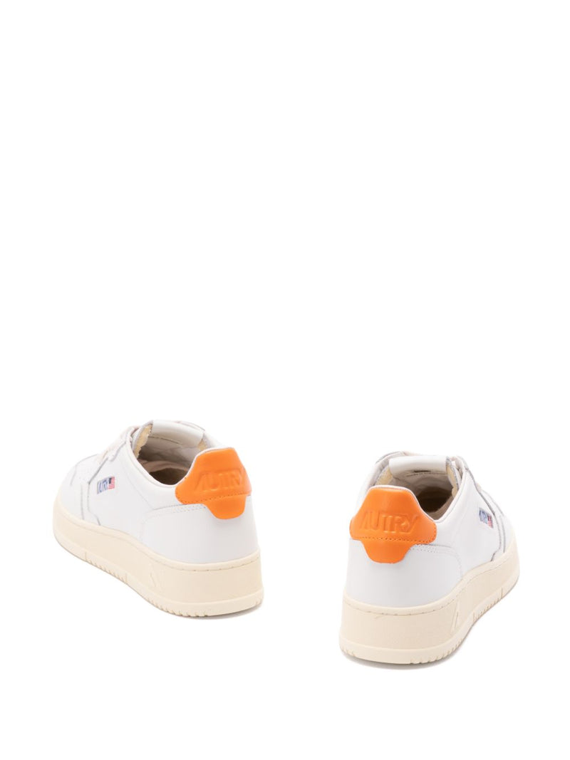 Autry MEDALIST LOW SNEAKERS IN WHITE LEATHER AND PARSIMMON ORANGE | Urbalenti™ NYC