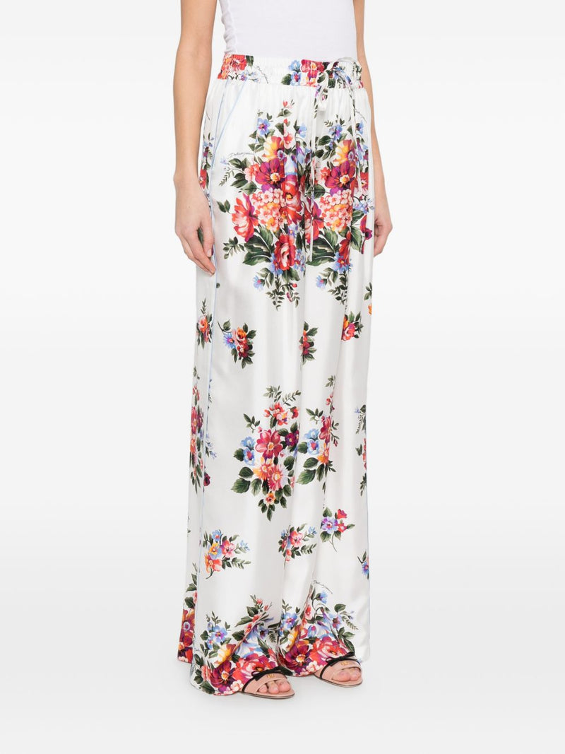 Dolce & Gabbana Flower print silk trousers | Urbalenti™ NYC