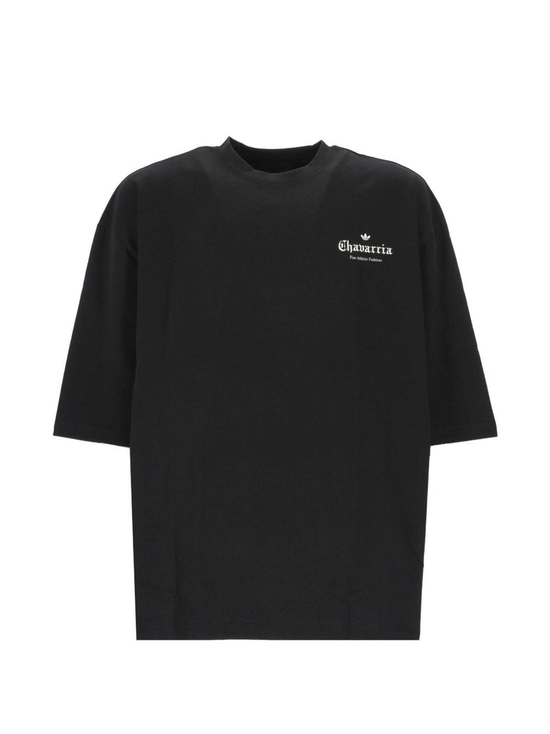 Front view of the 032C Adidas x Willy Chavarria Printed Cotton T-Shirt showcasing a relaxed black design, reflecting modern fashion trends by vendor 032C, ideal for casual wear. This stylish top belongs to the LDin collection for Men, specifically under Men > Clothing and Men > Clothing > Topwear, perfect for Spring - Summer 2026. Yes Eu.