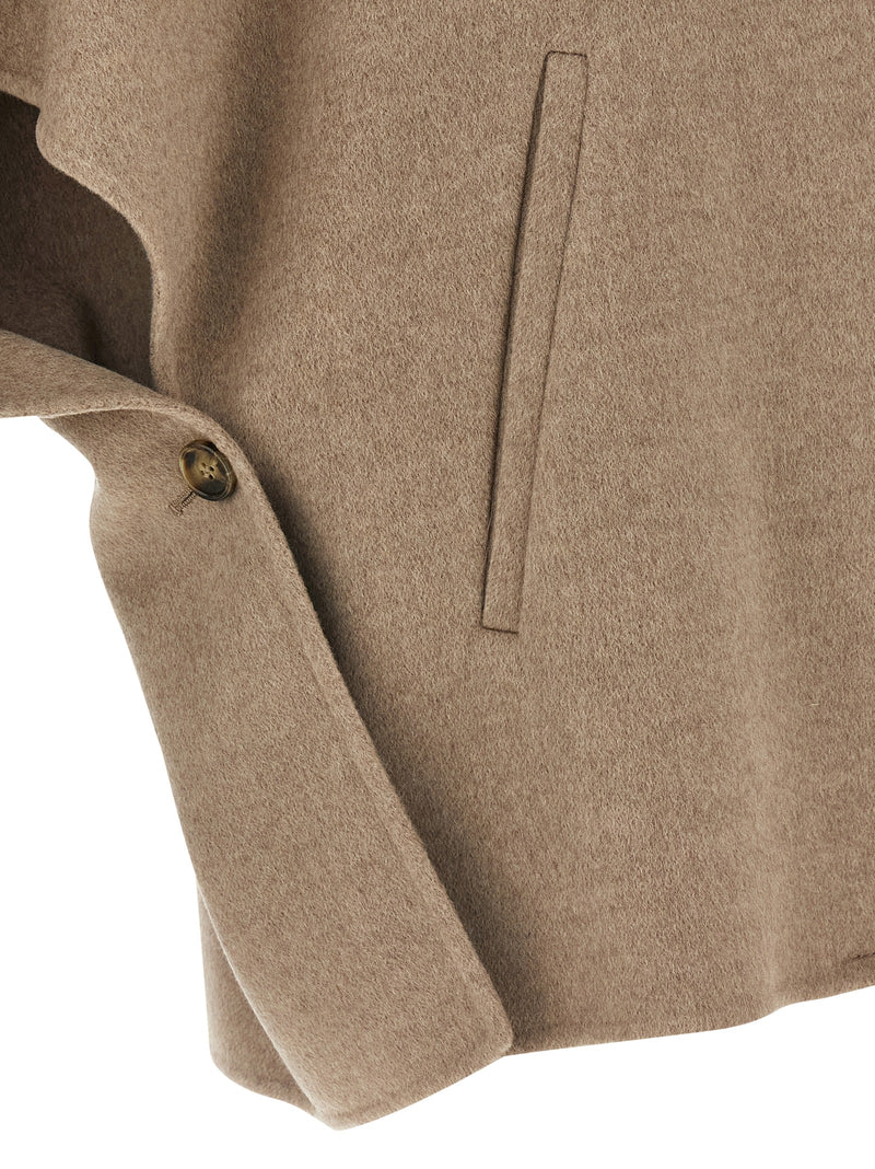 Detail shot of the button and pocket of the Max Mara Derrik Cape - Cashmere - Style 600001. This versatile Max Mara Cape Jacket is a must-have for Fall - Winter 2025/2026, embodying modern women's clothing trends.