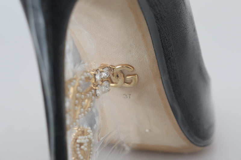 Zapatos de tacón negros de cuero de Dolce & Gabbana envueltos en plástico