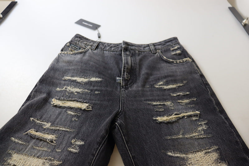 Calça jeans Dolce & Gabbana preta com lavagem desgastada, detalhes puídos e cintura alta