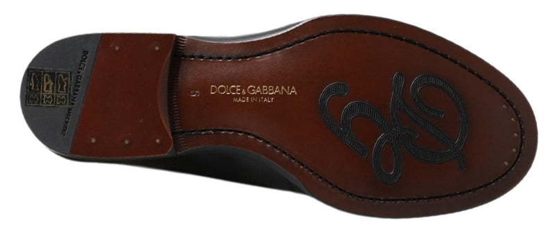 Zapatos Dolce & Gabbana negros de piel, tipo mocasín destalonado, con costuras