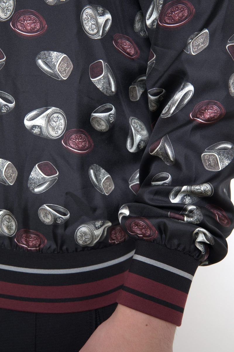 Suéter de cuello redondo de seda negra con estampado de anillos de Dolce & Gabbana