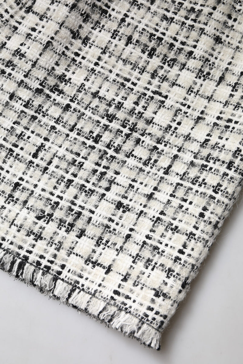 Minifalda de tweed de cuadros escoceses de talle alto en blanco y negro de Dolce & Gabbana