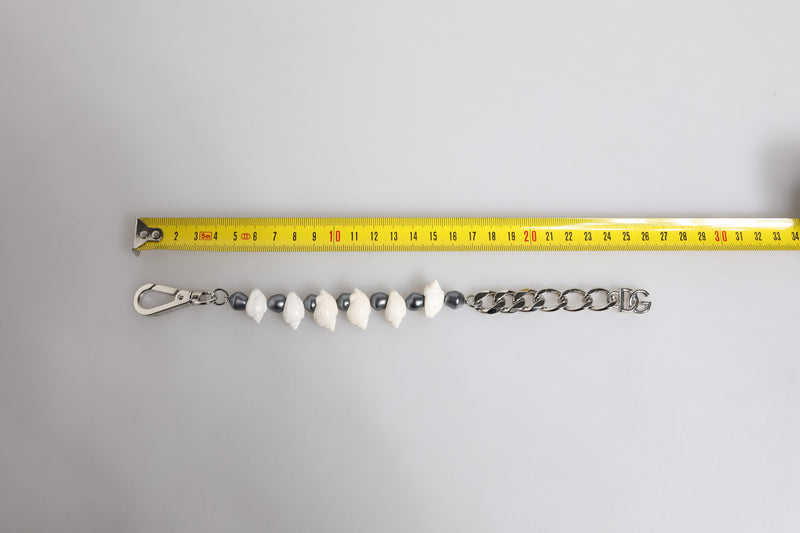 Pulseira de latão em tom prateado com contas, concha e pingente com logo DG Dolce & Gabbana