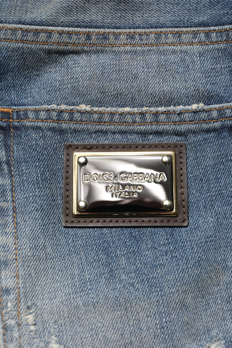 Jeans da uomo in denim blu di cotone effetto strappato Dolce & Gabbana