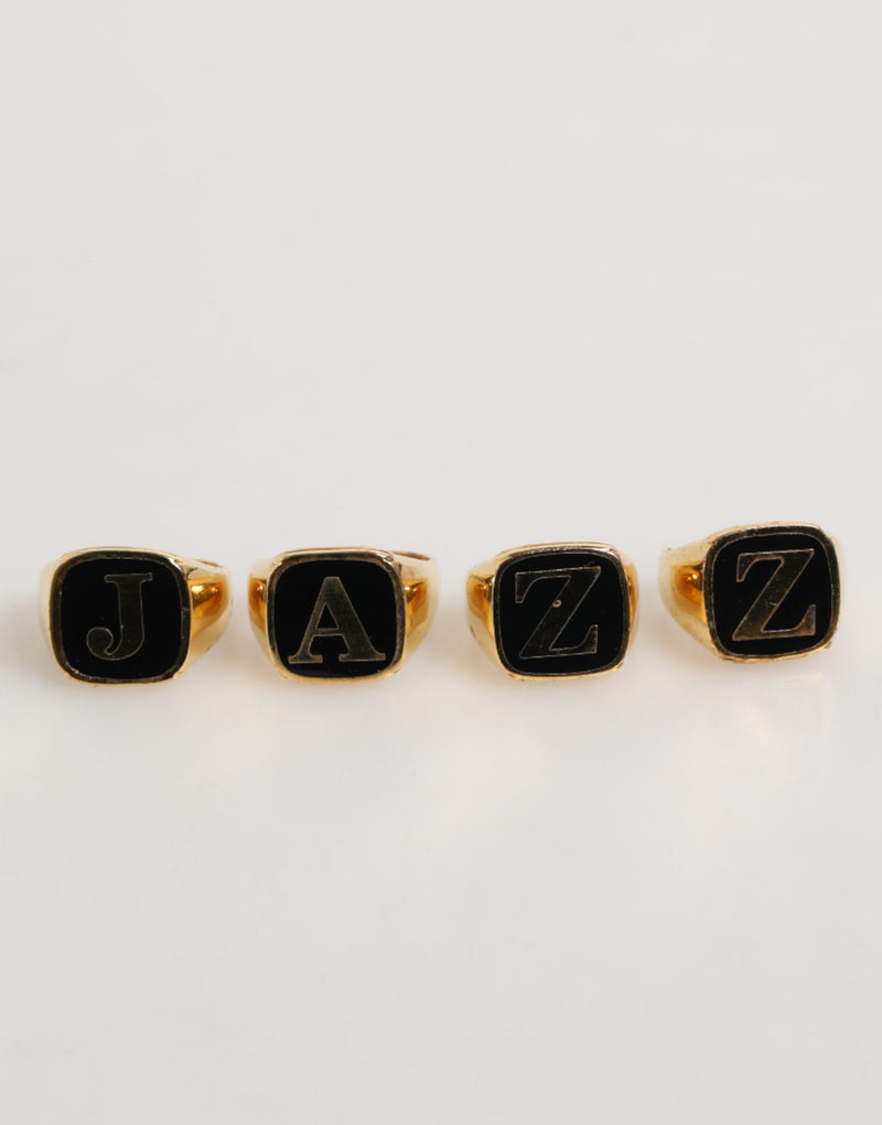 Anillo ajustable con letras JAZZ de latón en tono dorado, juego de 4 piezas Dolce & Gabbana