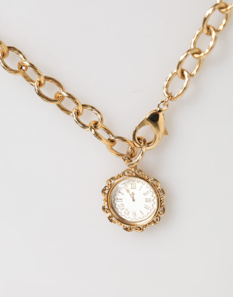 Collar llamativo con colgante de reloj y cristales dorados de Dolce & Gabbana