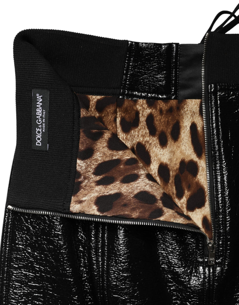 Minifalda negra de nailon revestido con detalles de ojales de Dolce & Gabbana