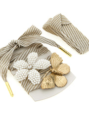 Chic ensemble of Golden Goose Skin Vintage Shoelaces showcasing floral and butterfly charms with rhinestones, curated by Golden Goose. Perfect for personalizing your footwear. Captured for LDin, Spring - Summer 2026, Women, Women > Accessories, Women > Accessories > Jewellery, Yes Eu, Golden Goose Skin Vintage Shoelaces.
