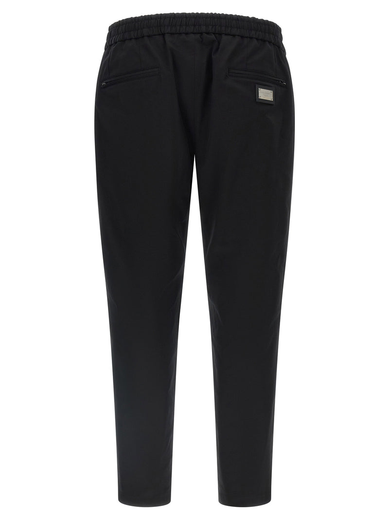 Dolce & Gabbana Logo Plaque Pants | URBALENTI™ NYC