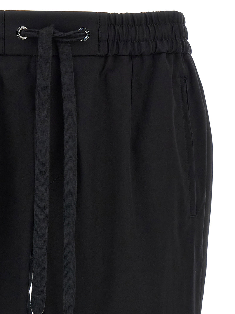 Dolce & Gabbana Logo Plaque Pants | URBALENTI™ NYC